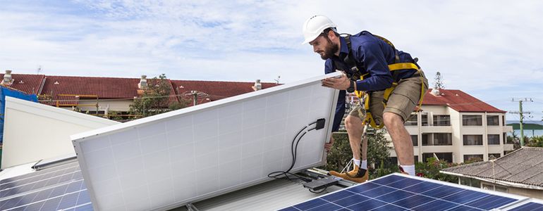 Man fitting solar panels